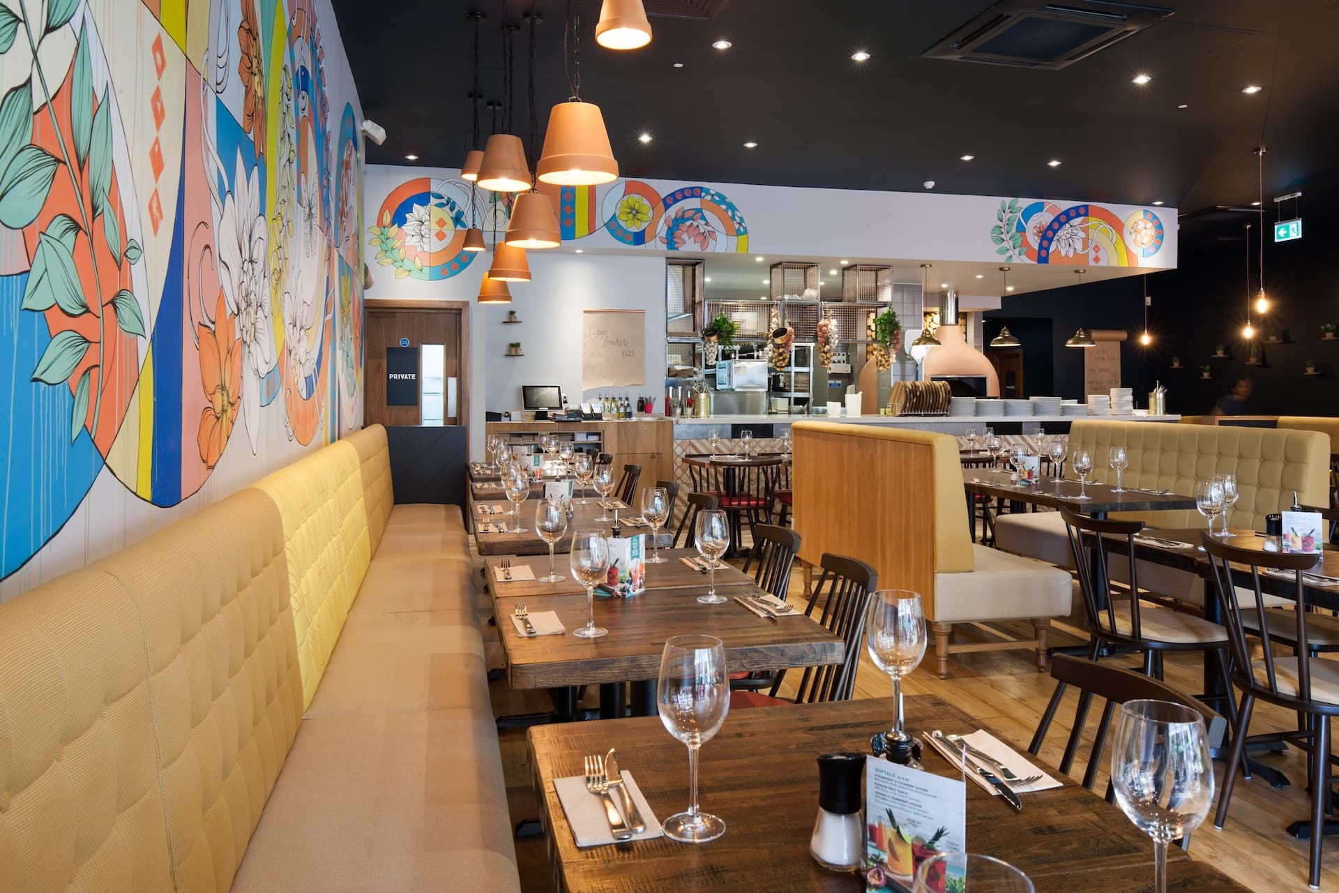 Stylish dining area at Zizzi Staines with modern decor and natural accents.