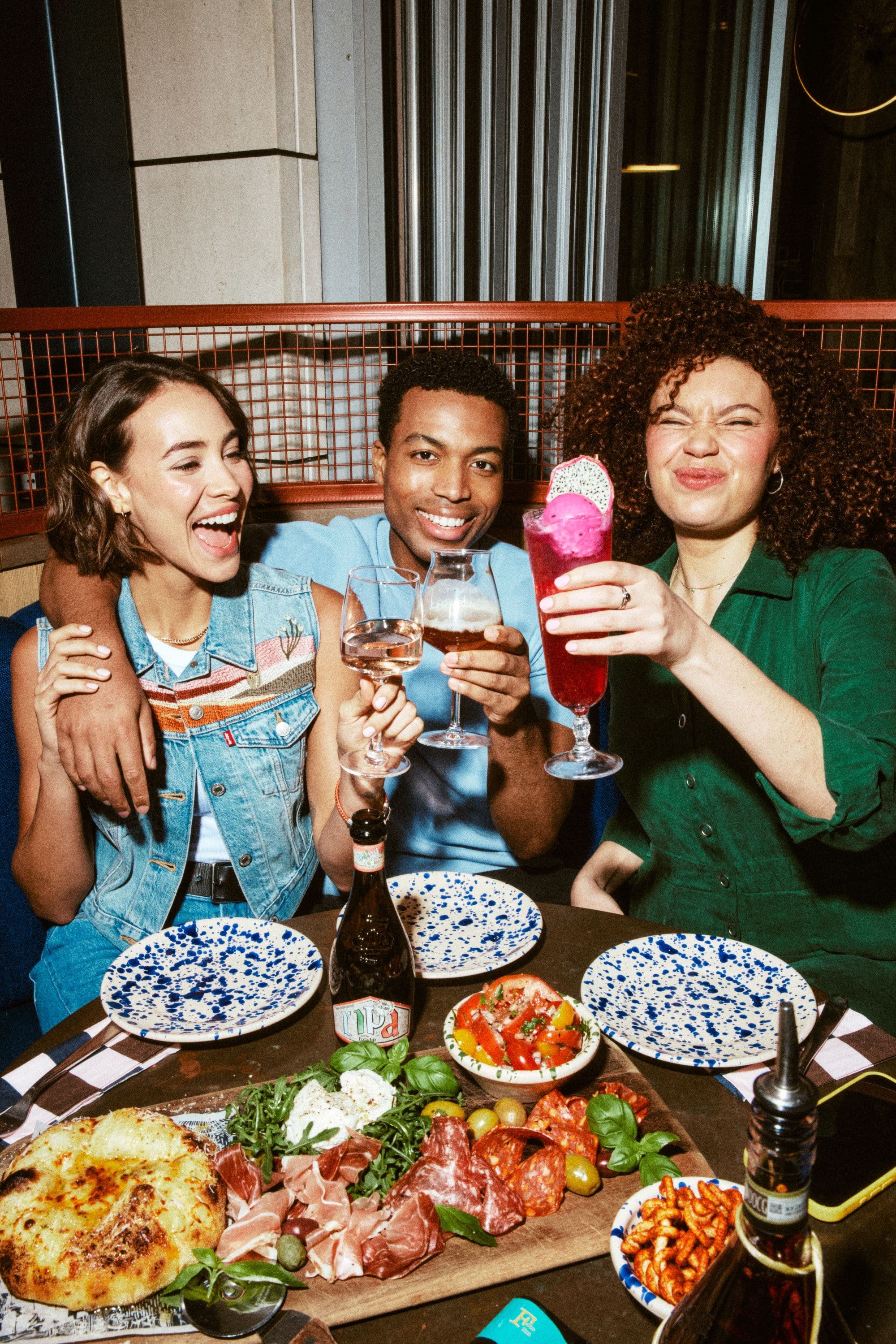 Group of friends sat around the table enjoying food