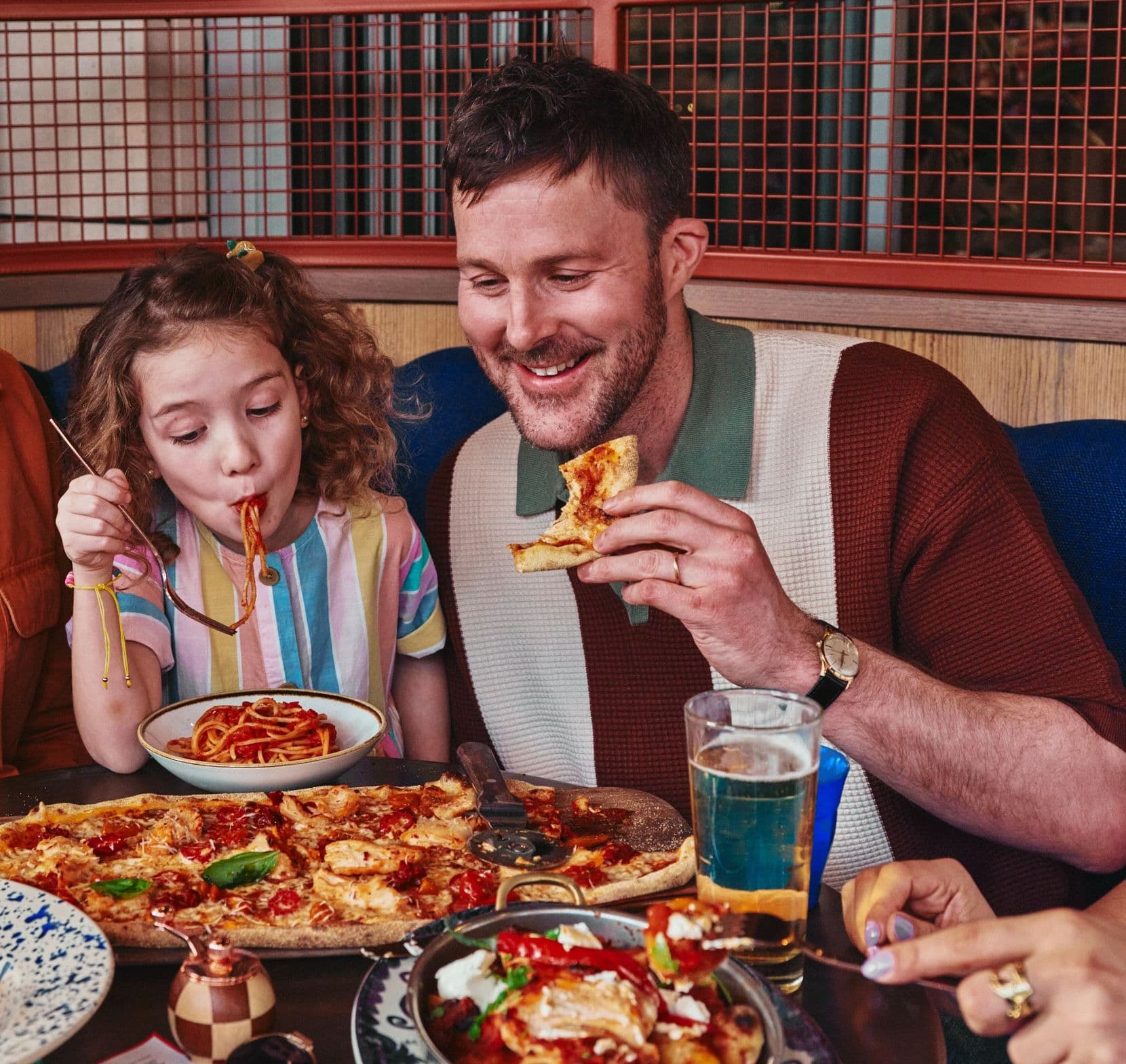 Dad enjoying lunch with daughter
