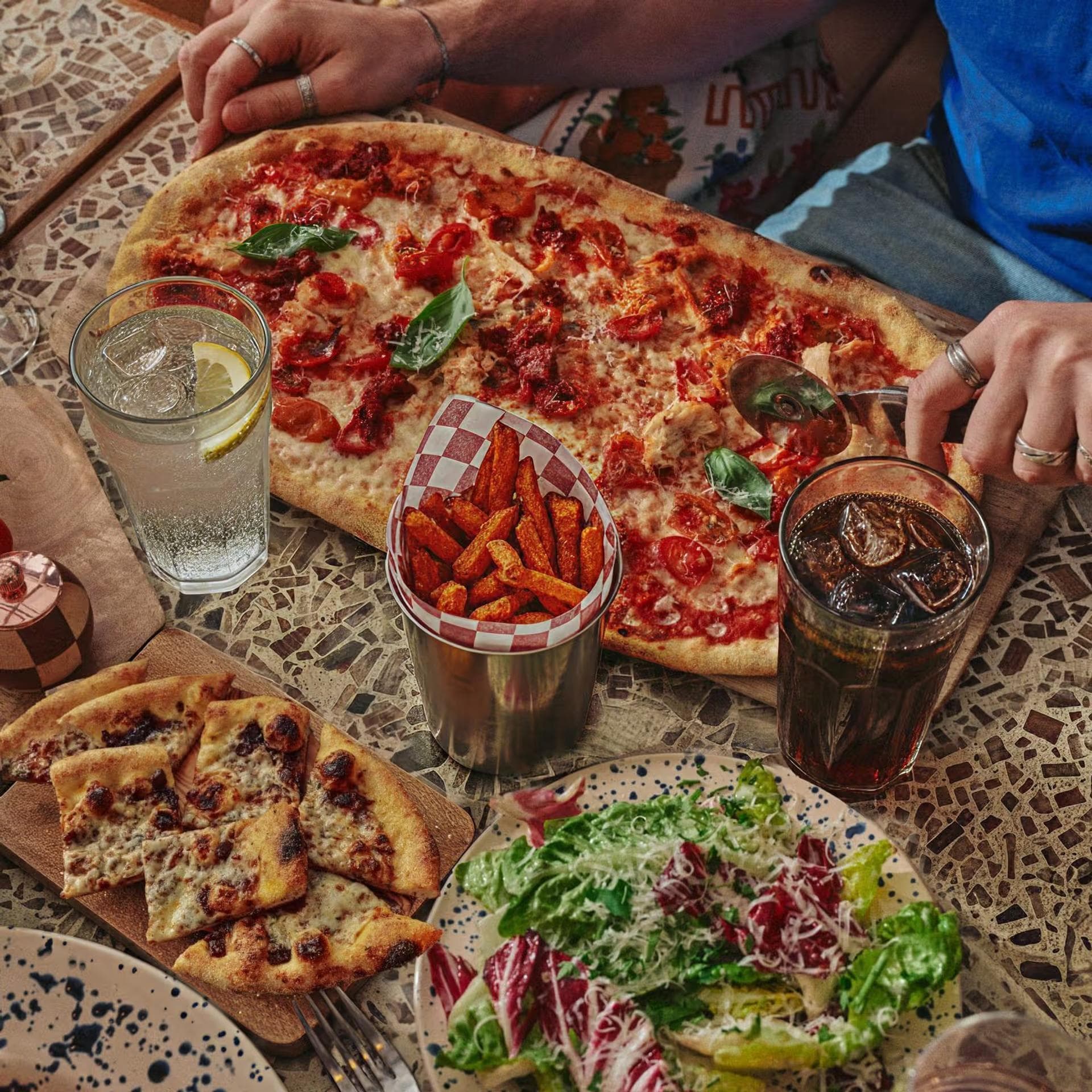 Feast shot of pizza, garlic bread and salad