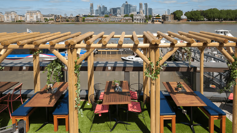 Roof terrace at Zizzi Greenwich, overlooking the River Thames and Canary Wharf