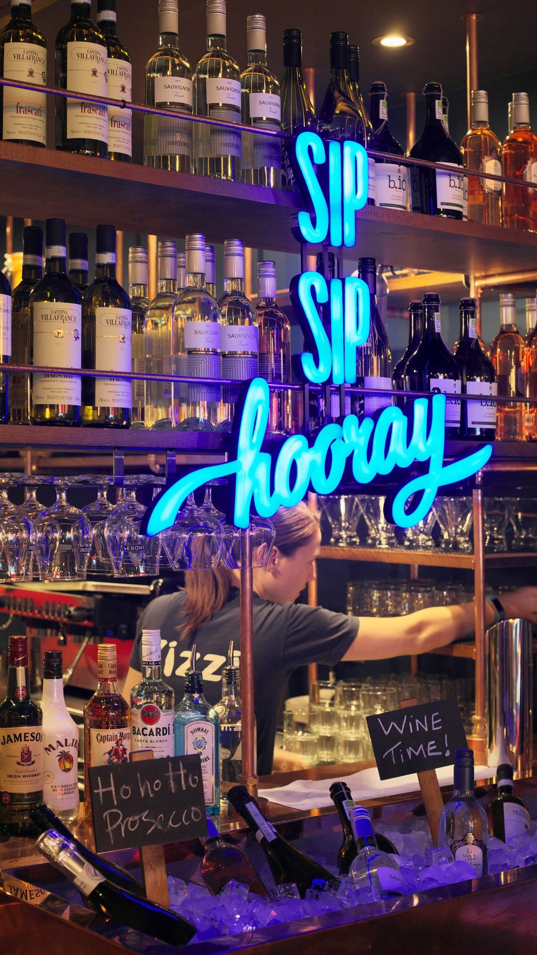 Neon sign saying sip sip hooray Zizzi Dublin Suffolk Street. 