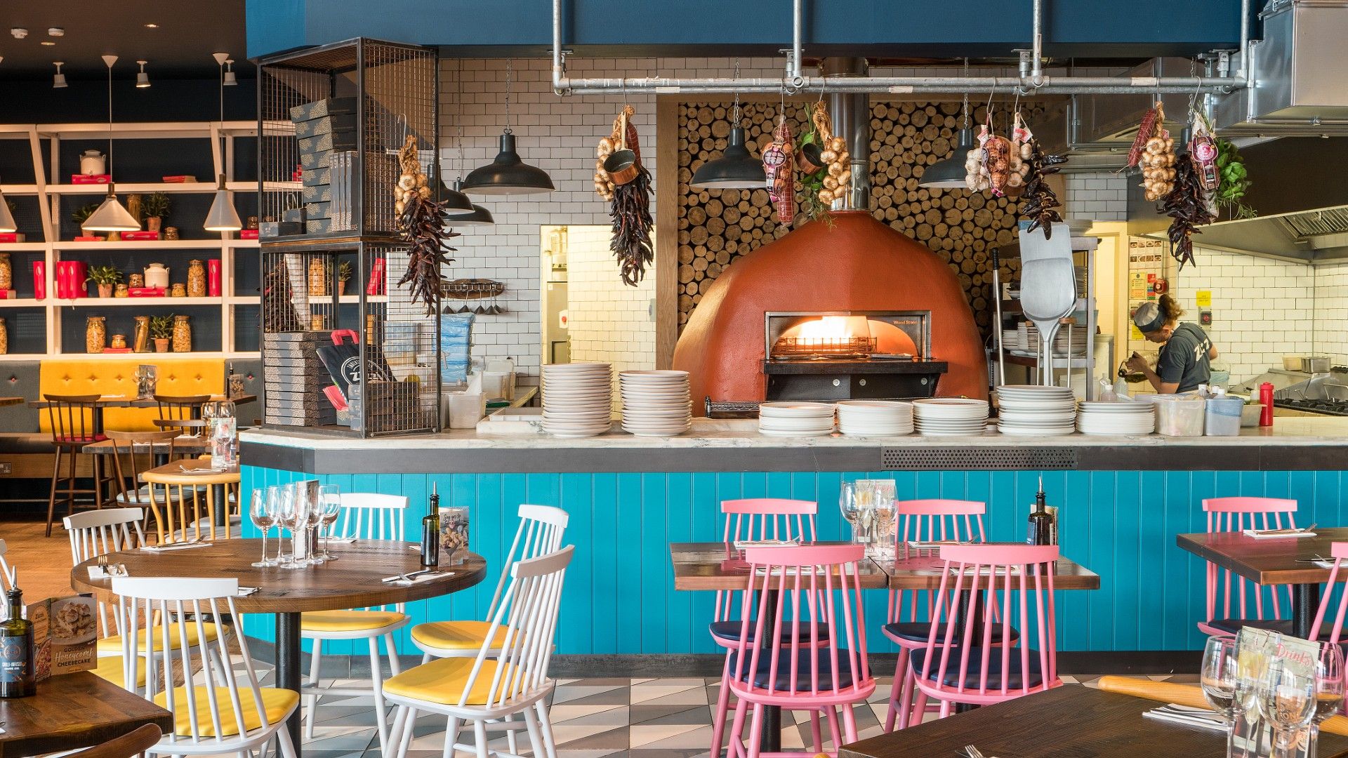 Tables and chairs with pizza oven Zizzi Wembley. 
