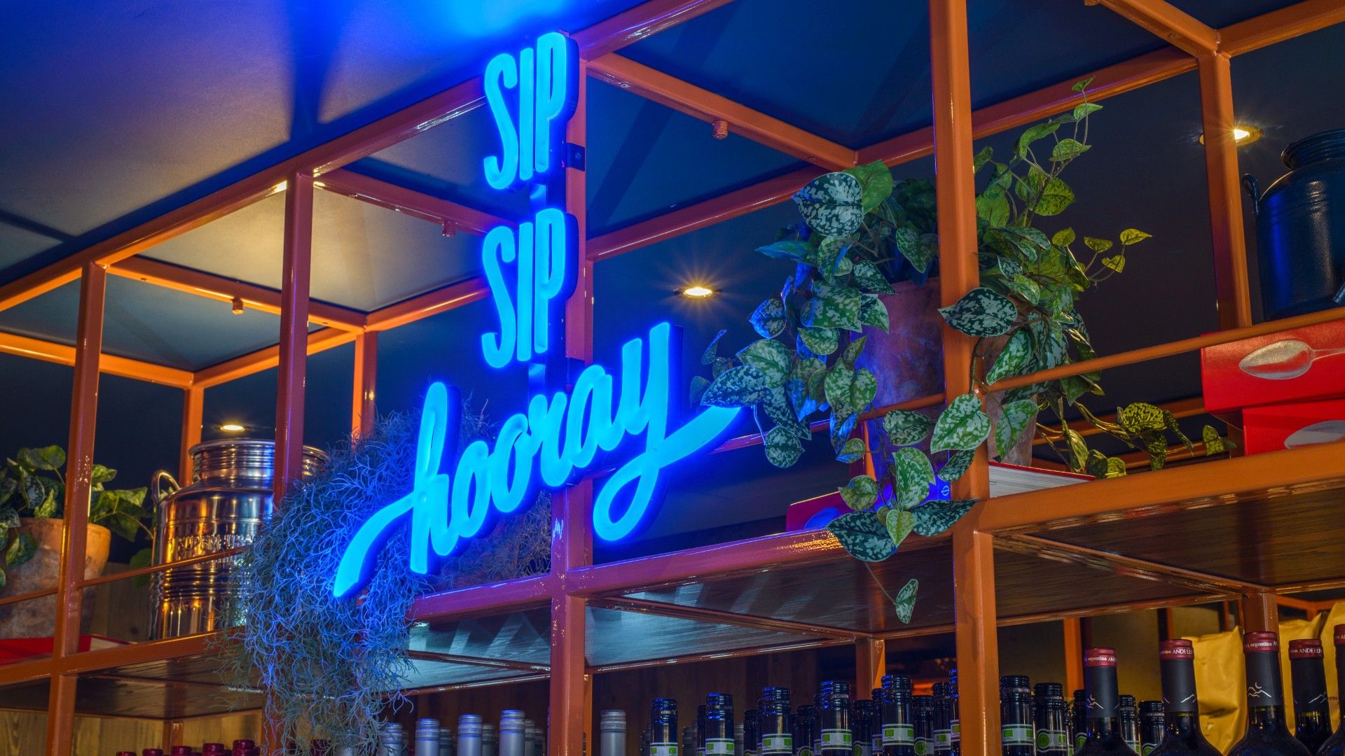 Neon sign saying Sip Sip Hooray Zizzi Lancaster 